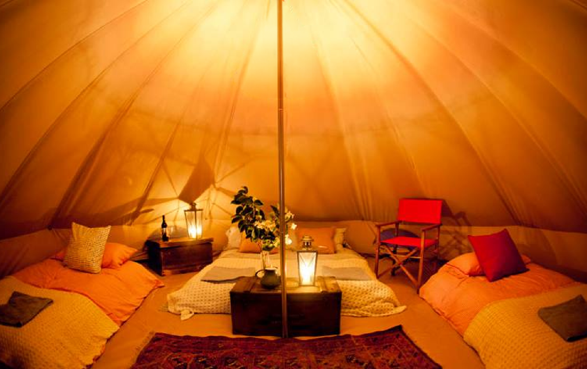 interior of glamping tent with yellowed lighting
