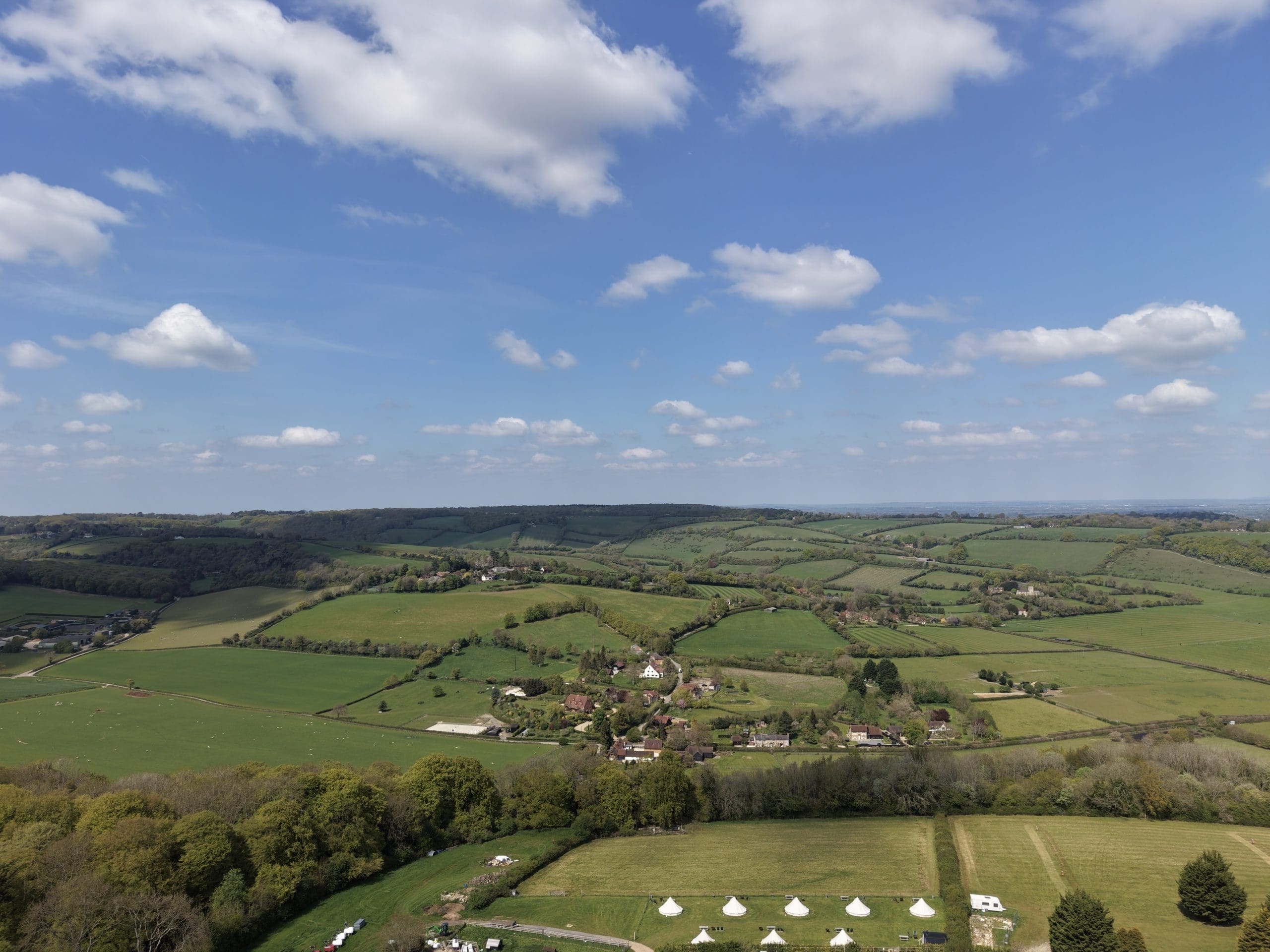 rolling countryside hills with hedgerows outlining fields