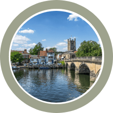 view of the river Thames and Henley bridge with trees and buildings over the other side of the river